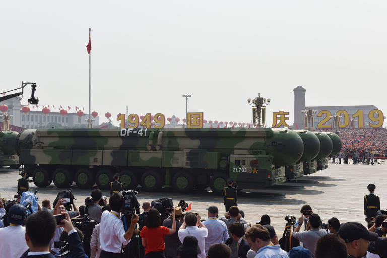 Military vehicles carry Chinese DF-41 nuclear-capable intercontinental ballistic missiles in a military parade in Beijing, China, on October 1, 2019. China claimed that its nuclear weapons development was a historic choice forced to be made. GREG BAKER/AFP via Getty Images