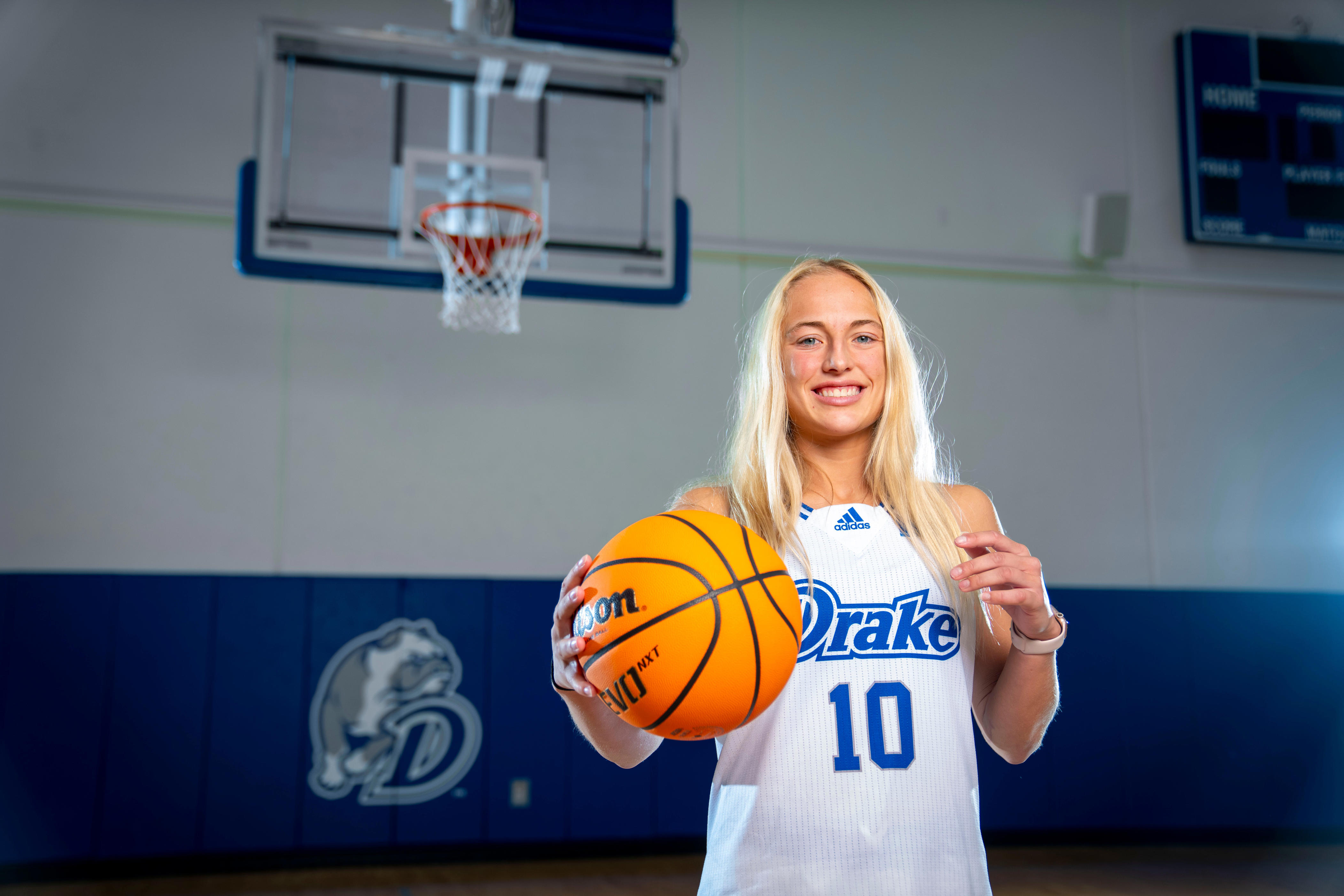 Drake women's basketball Katie Dinnebier passing on basketball to