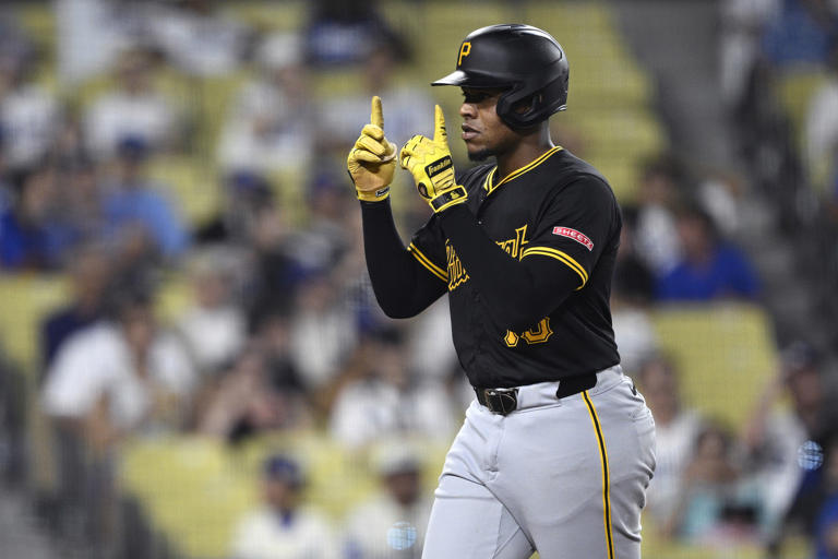 LOS ANGELES, CALIFORNIA - AUGUST 10: Ke'Bryan Hayes #13 of the Pittsburgh Pirates celebrates after hitting a home run against the Los Angeles Dodgers during the ninth inning at Dodger Stadium on August 10, 2024 in Los Angeles, California. Orlando Ramirez/Getty Images