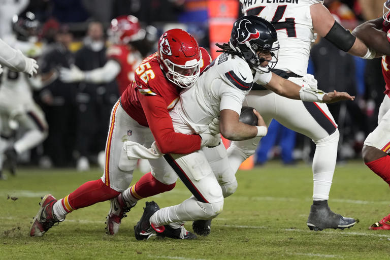 Houston Texans quarterback C.J. Stroud (7) is sacked for a 6-yard loss by Kansas City Chiefs defensive end George Karlaftis (56) during the second half of an NFL football AFC divisional playoff game Saturday, Jan. 18, 2025, in Kansas City, Mo. (AP Photo/Ed Zurga)