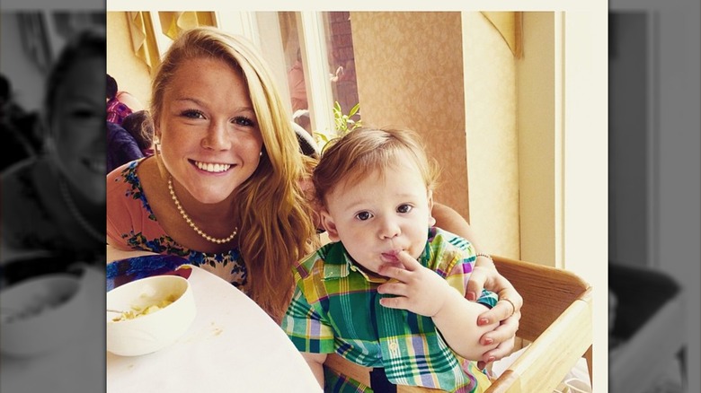 Young Karoline Leavitt with arm around young child