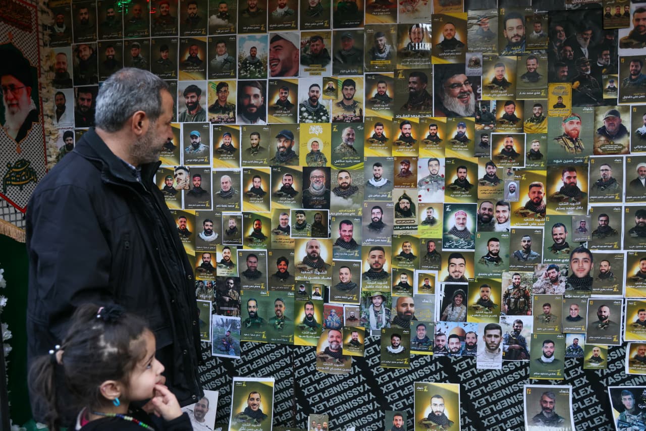 A wall covered with portraits of dead Hezbollah members during a funeral ceremony in southern Lebanon.