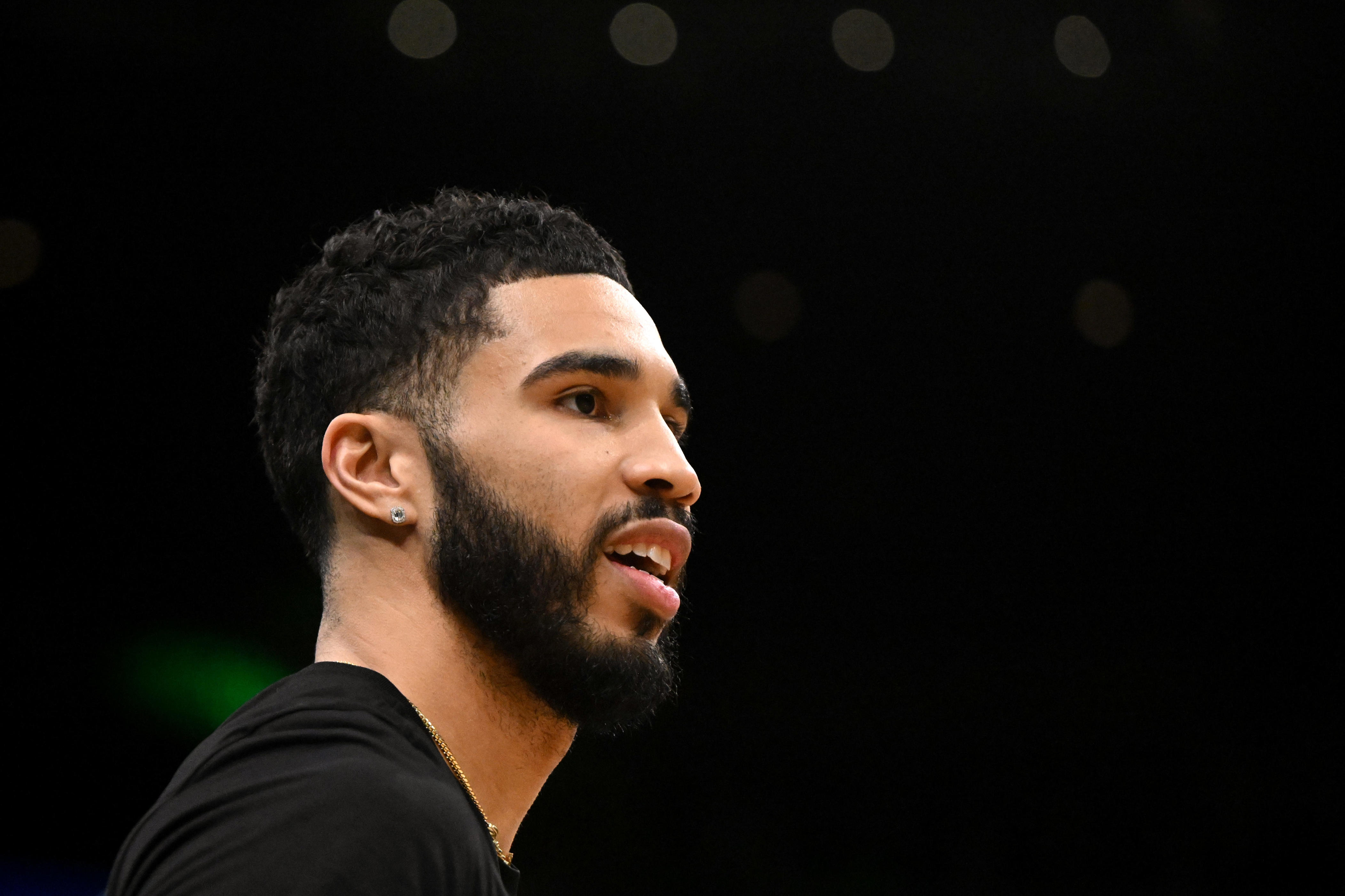 BOSTON, MASSACHUSETTS - FEBRUARY 06: Jayson Tatum #0 of the Boston Celtics watches warmups before a game against the Dallas Mavericks at the TD Garden on February 06, 2025 in Boston, Massachusetts. NOTE TO USER: User expressly acknowledges and agrees that, by downloading and or using this photograph, User is consenting to the terms and conditions of the Getty Images License Agreement. (Photo by Brian Fluharty/Getty Images)