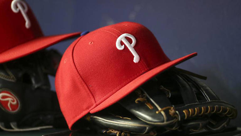 Detailed view of a Philadelphia Phillies hat and glove | Brett Davis-Imagn Images