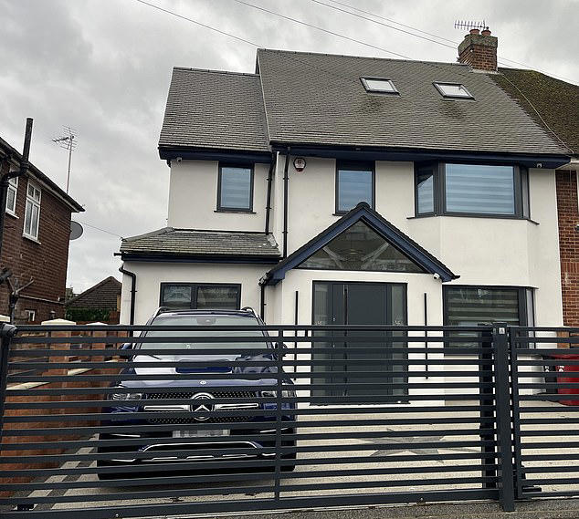 Varun Sharma, 41, built a first-floor extension and a wrap-around 'spice kitchen' at the rear of his property in Marlsborough Road, Slough, last April - but contracted builders went 'a little bit over' the agreed dimensions