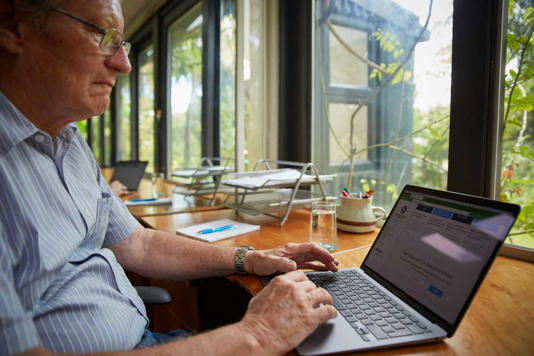 Old person using a laptop