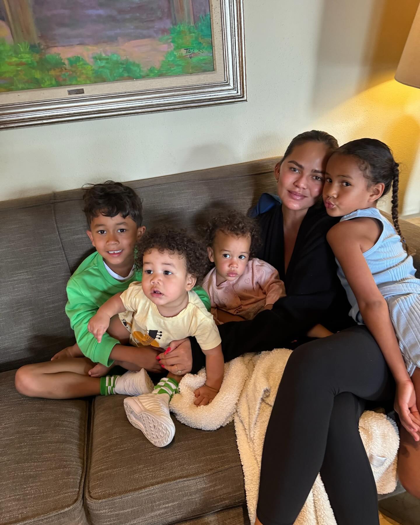 Chrissy Teigen defends taking ‘coconut milk bath’ with 3 of her kids