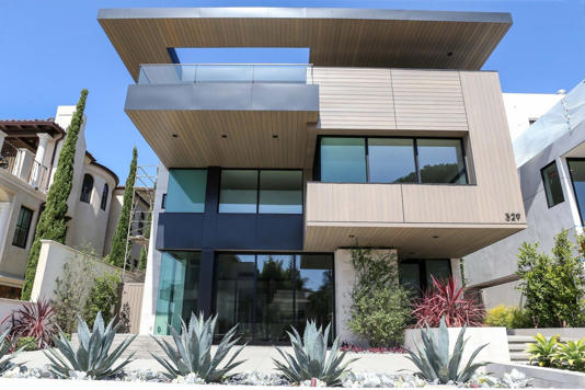 Modern multi-level house with landscaped garden.