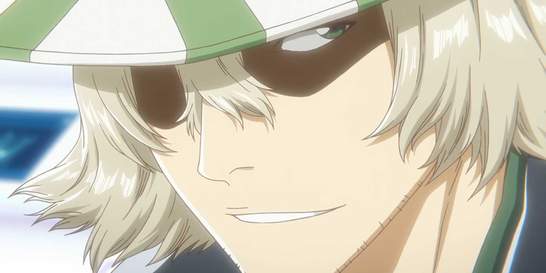 Kisuke Urahara grins in Bleach.