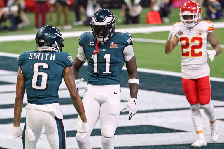 Feb 9, 2025; New Orleans, LA, USA; Philadelphia Eagles wide receiver A.J. Brown (11) congratulates wide receiver DeVonta Smith (6) after he scored a touchdown against the Kansas City Chiefs during the second half of Super Bowl LIX at Caesars Superdome. Mandatory Credit: Bill Streicher-Imagn Images