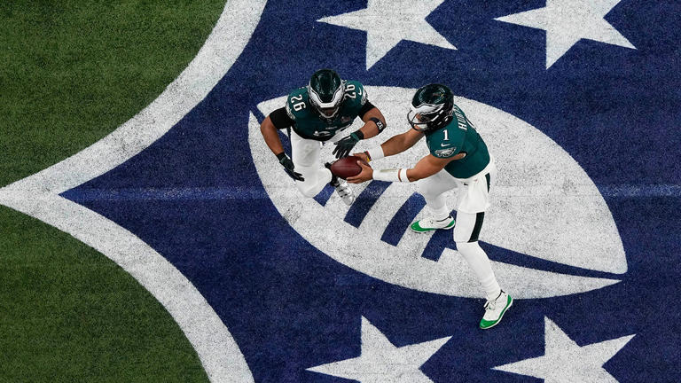 Philadelphia Eagles quarterback Jalen Hurts hands the ball off to running back Saquon Barkley during Super Bowl LIX, Sunday, Feb. 9, 2025, in New Orleans. AP Newsroom