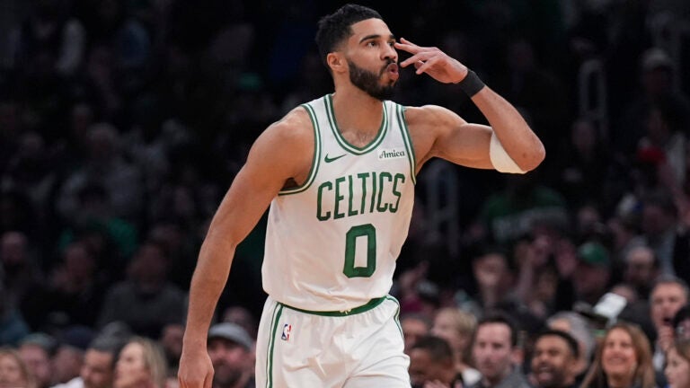 Celtics forward Jayson Tatum blows a kiss after hitting a 3-pointer against the San Antonio Spurs during the first half.