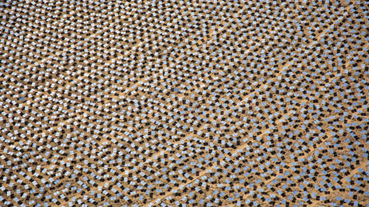 Ivanpah's around 350,000 mirrors focus sunlight onto three towers, where water is turned to steam to generate electricity. - Jim West/REA/Redux