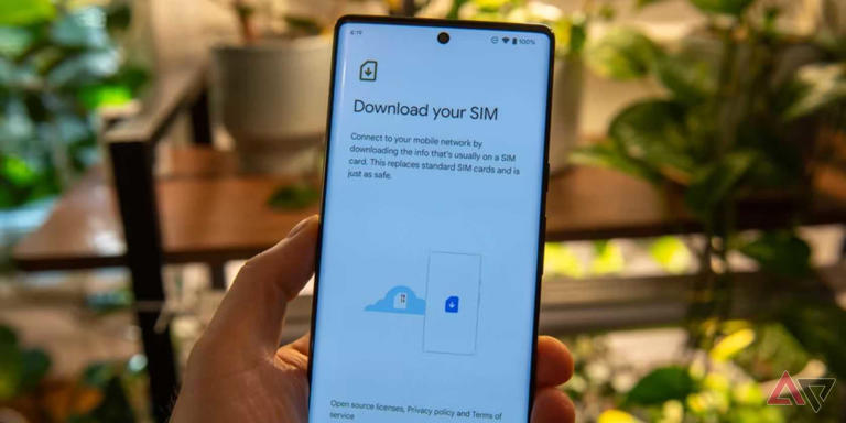 hand holding android phone with esim settings