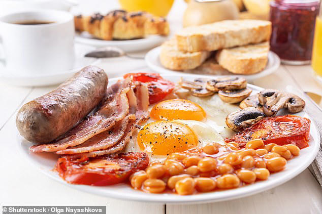 Tucking into breakfast before 9am could significantly reduce your risk of suffering depression, a study suggests (stock photo)
