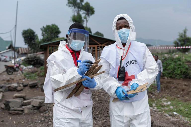 A Red Cross team member marks body references on the day of the burial of victims of the fighting in Goma, following the intensification of fighting between M23 rebels and the Congolese army, at ITIG Cemetery, in Goma, North Kivu province, in eastern Democratic Republic of the Congo, February 3, 2025. REUTERS/Arlette Bashizi