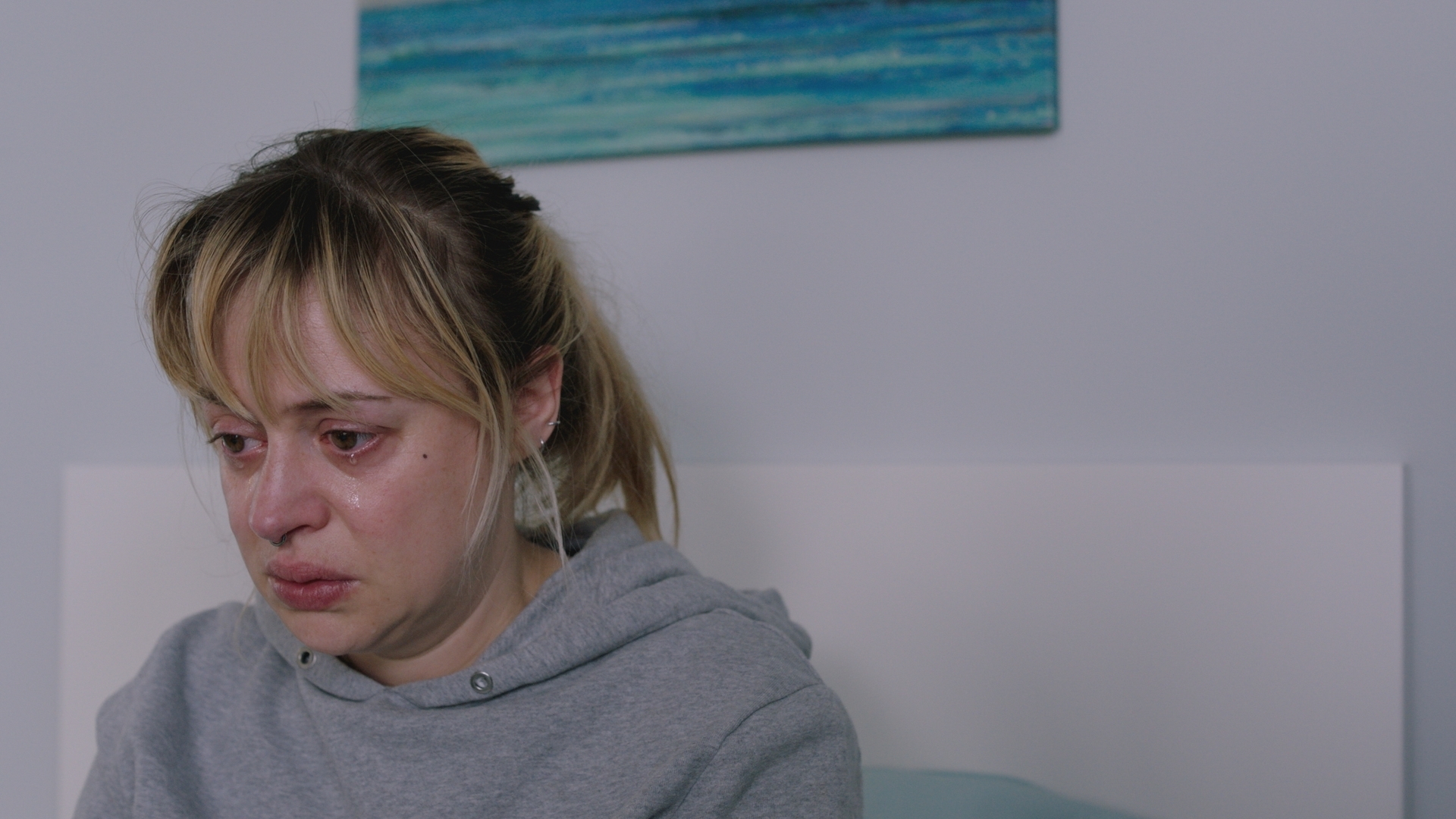 Nicole is cared for by her colleagues. (Image credit: BBC Studios. )