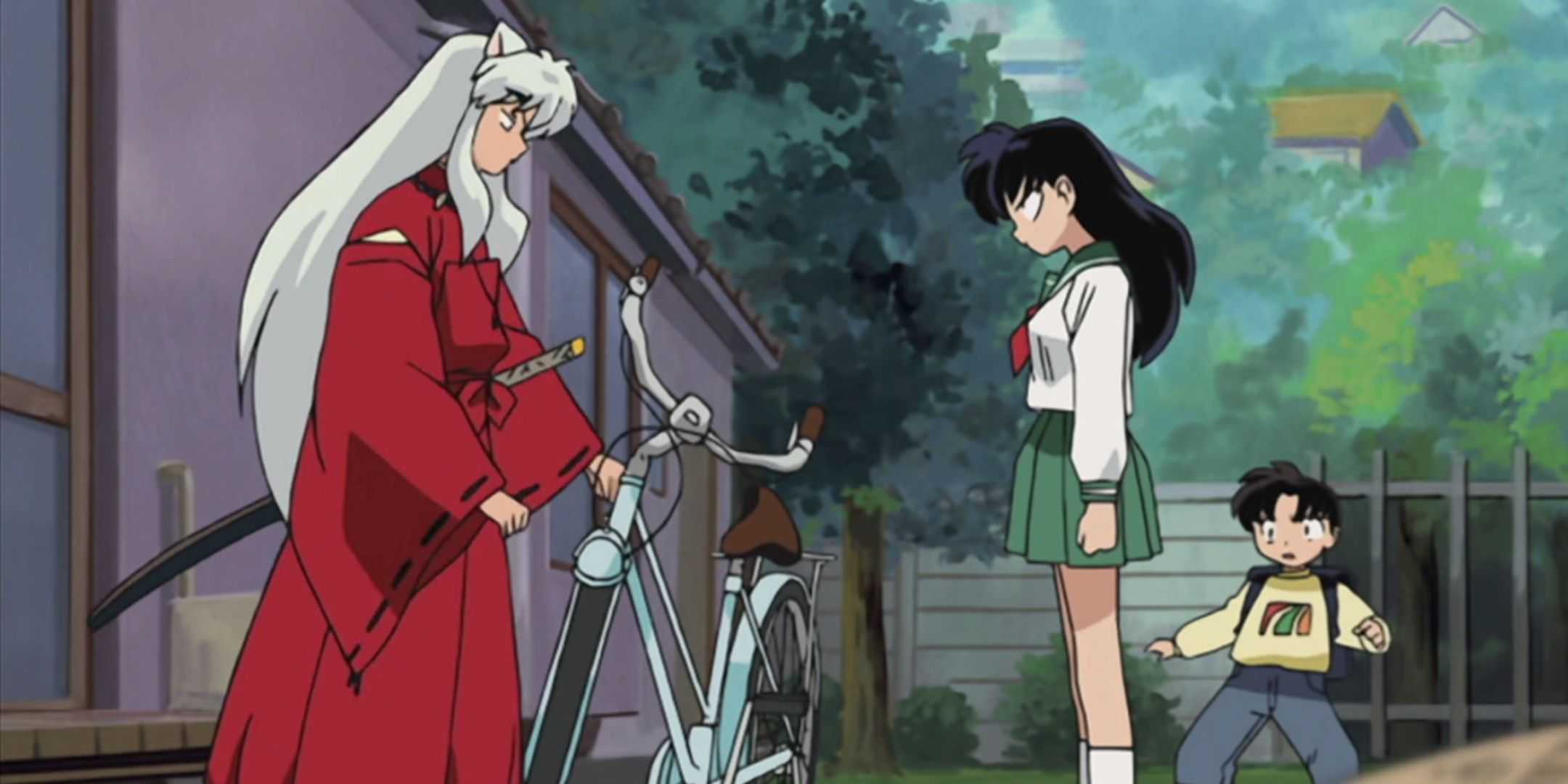 An annoyed Kagome confront Inuyasha across a silver bike while Sota looks on in shock