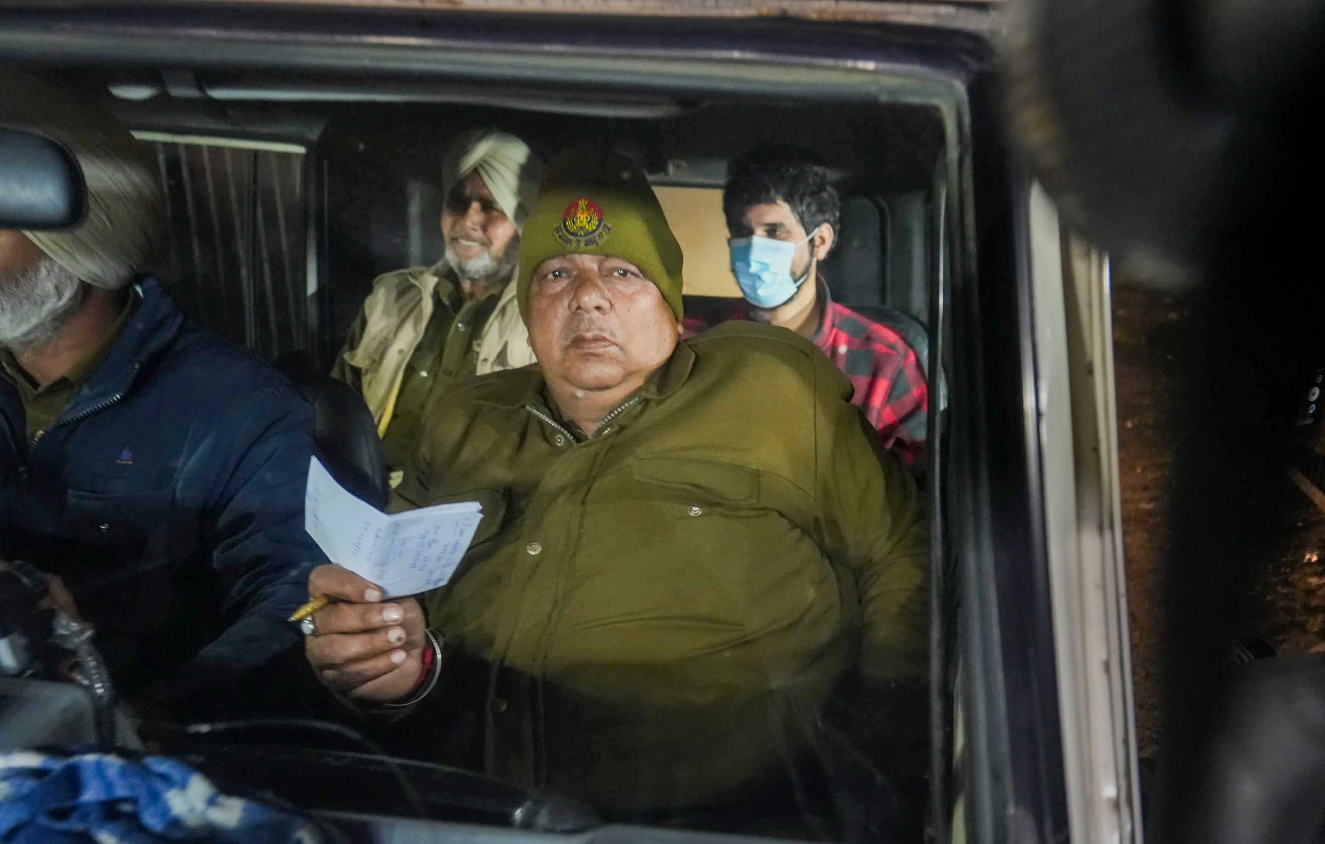 Amritsar: Police personnel take deported immigrants for initial questioning after a US military aircraft carrying them landed at the Shri Guru Ramdas Ji International Airport, in Amritsar, Wednesday, Feb. 5, 2025. (PTI Photo/Shiva Sharma)(PTI02_05_2025_000587A)