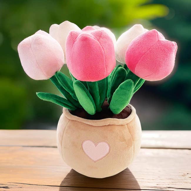 A plush bouquet of tulip-shaped toys in a heart-decorated vase, suitable for decoration or gifting