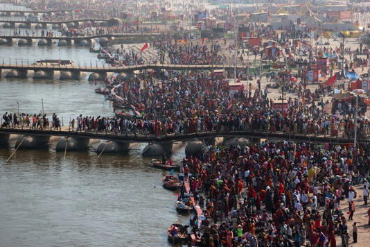 FILE PHOTO: Devotees gather to take a dip at Sangam, the confluence of the Ganges and Yamuna rivers with the mythical invisible Saraswati river, to mark Maghi Purnima, one of the auspicious days during the "Maha Kumbh Mela", or the Great Pitcher Festival, in Prayagraj, India, February 12, 2025. REUTERS/Ritesh Shukla/File Photo