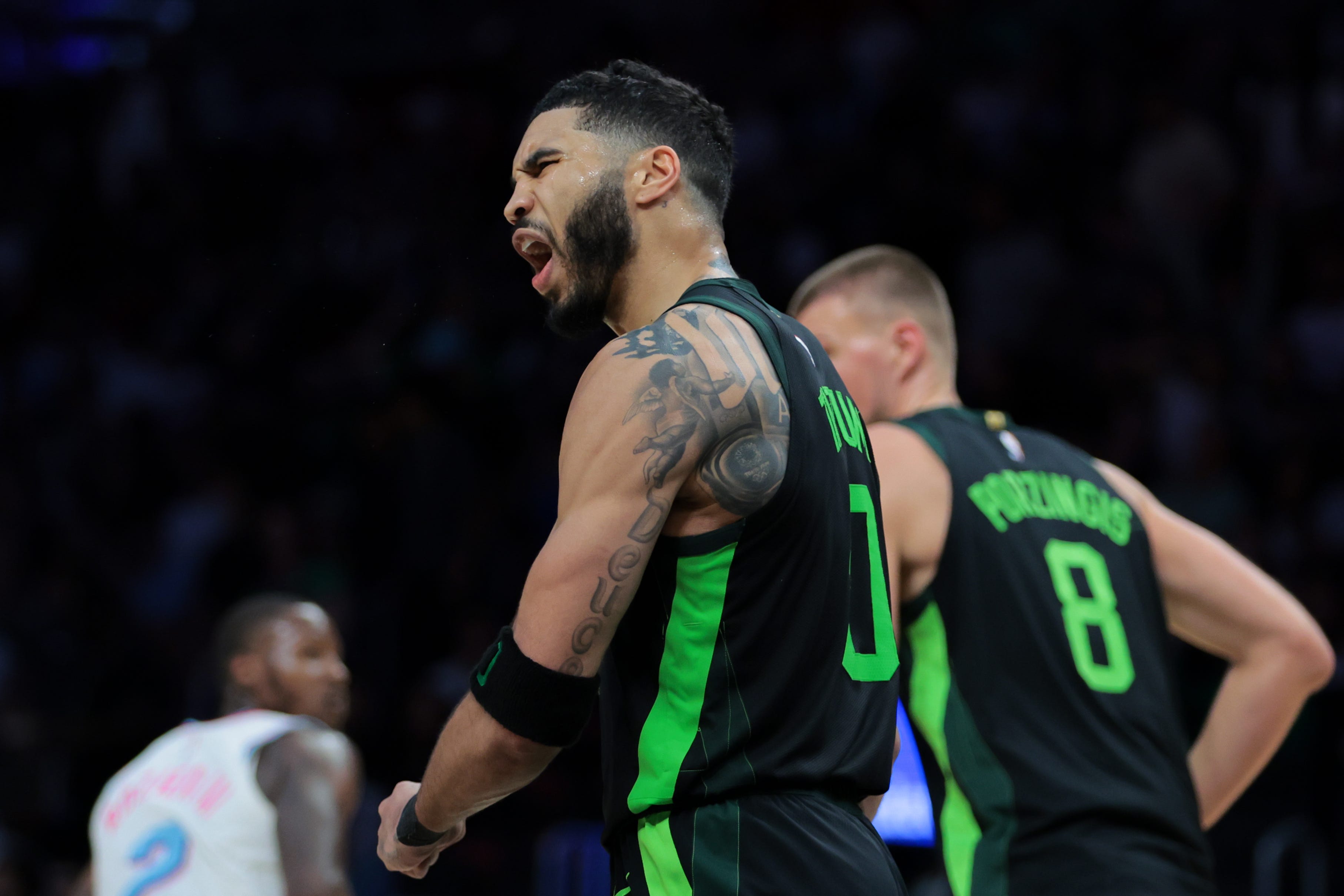 Feb 10, 2025; Miami, Florida, USA; Boston Celtics forward Jayson Tatum (0) reacts after scoring against the Miami Heat during the fourth quarter at Kaseya Center. Mandatory Credit: Sam Navarro-Imagn Images