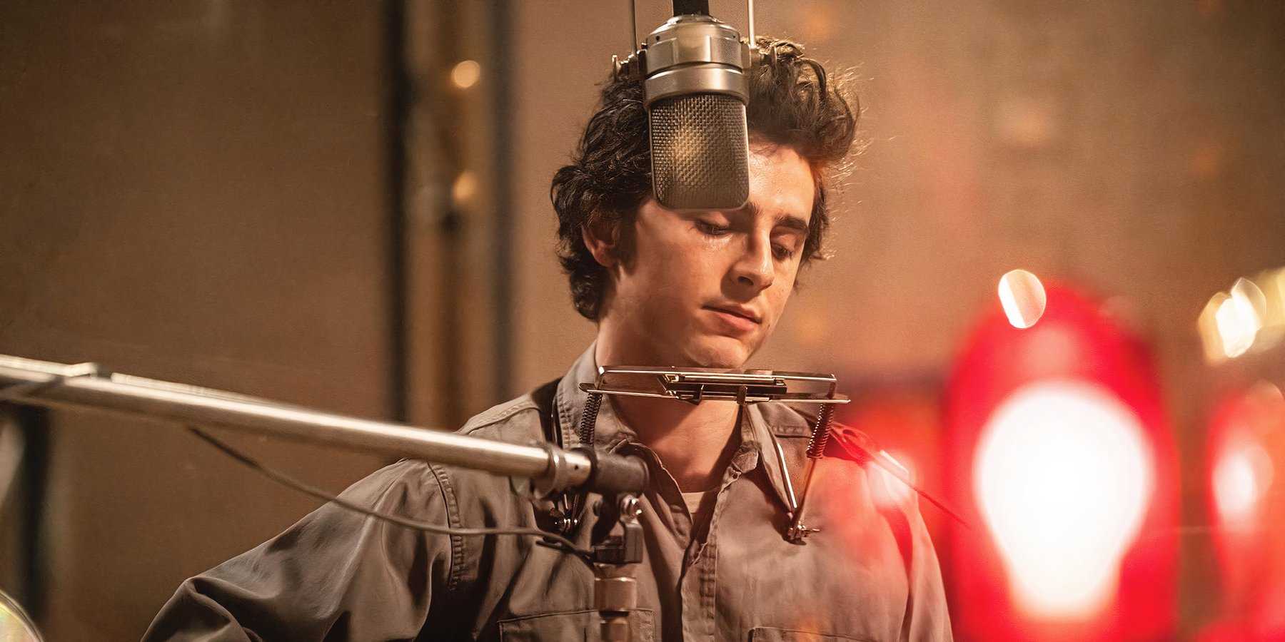 Timothée Chalamet as Bob Dylan recording a song in the studio in A Complete Unknown