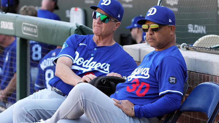 Feb 21, 2025; Mesa, Arizona, USA; Los Angeles Dodgers manager Dave Roberts (30) gets ready for a spring training game against the Chicago Cubs at Sloan Park. Mandatory Credit: Rick Scuteri-Imagn Images | Rick Scuteri-Imagn Images