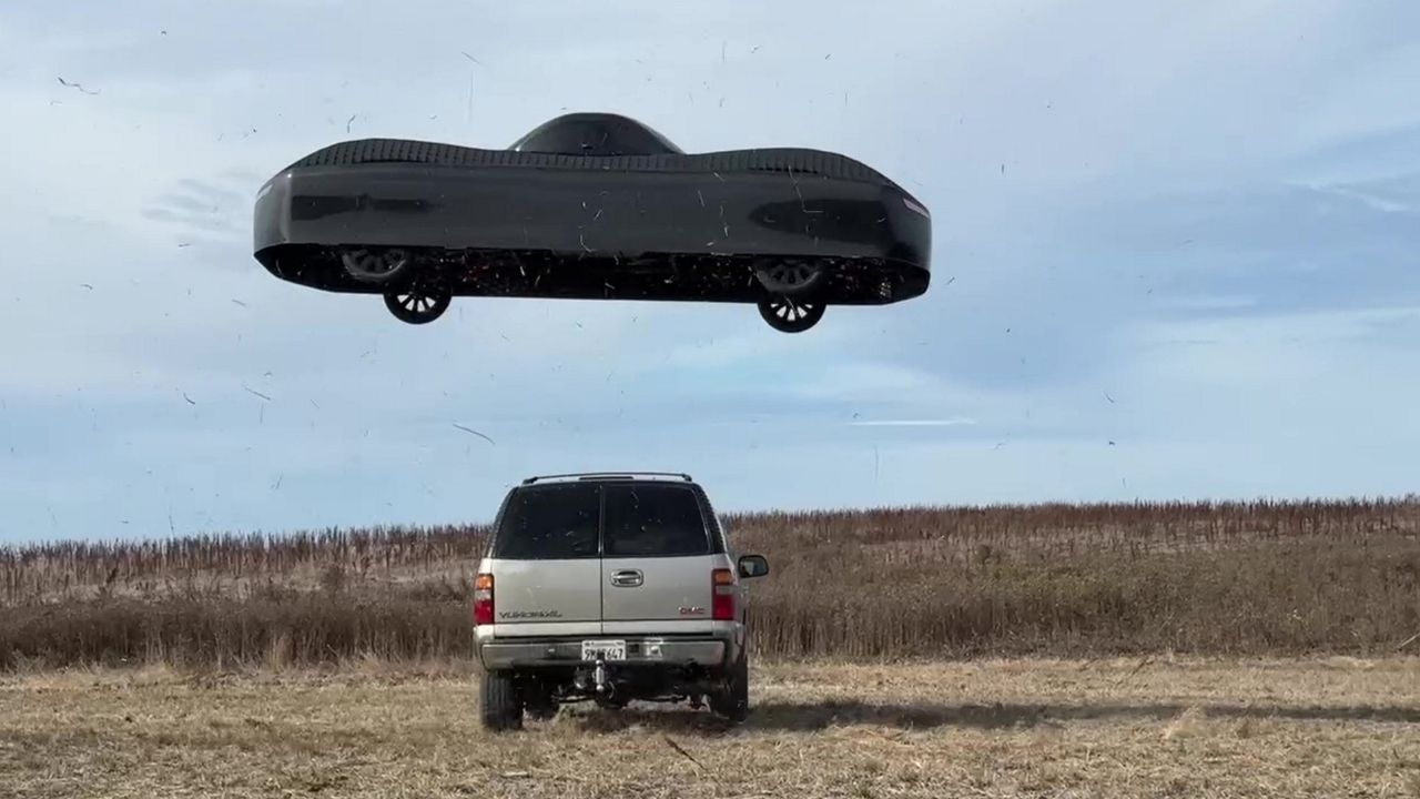 Flying car soars over traffic in 'world first'