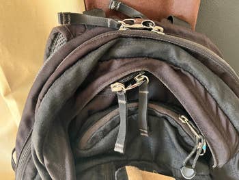 Close-up of a backpack with zippers and compartments, showcasing its storage features for an article about shopping for bags