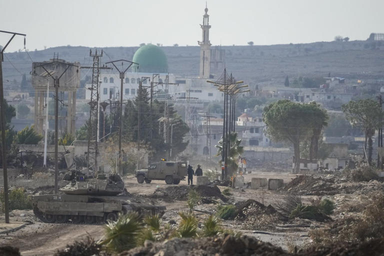 Israeli army armored vehicles blocking a road leading to the Syrian town of Quneitra in early January.