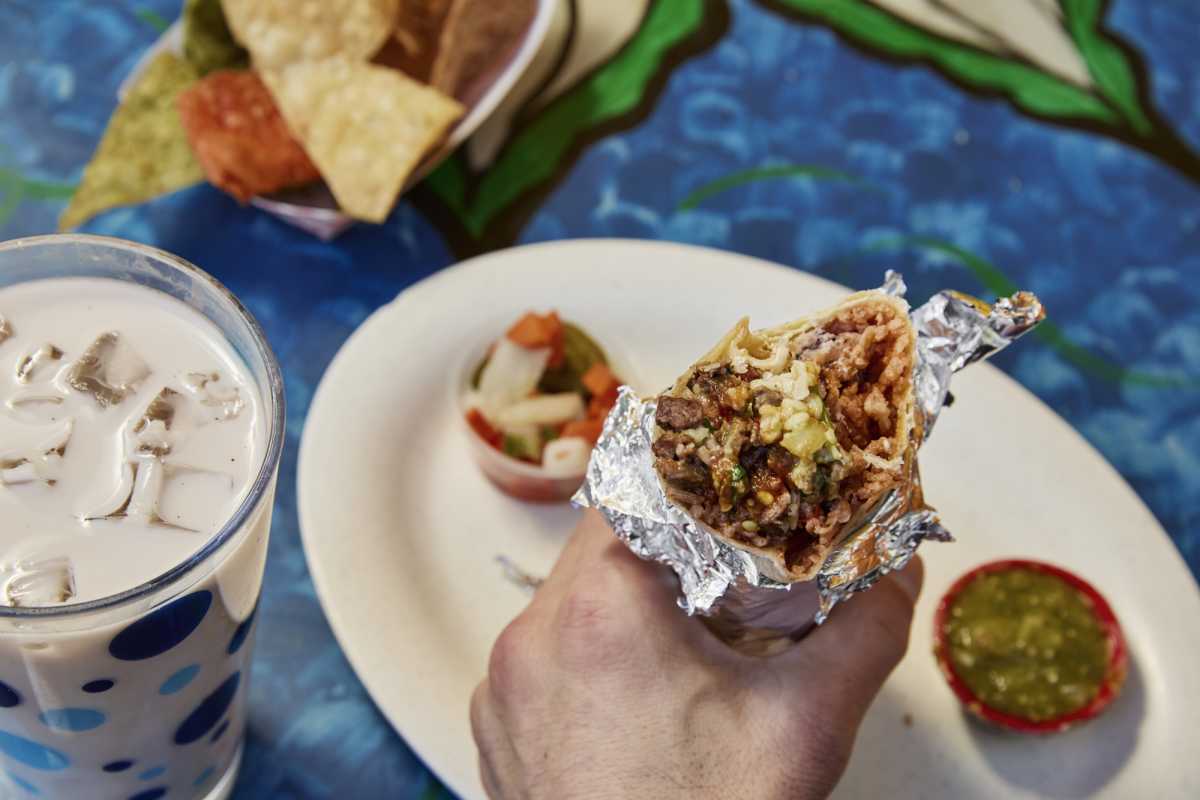 burrito bit in half next to horchata