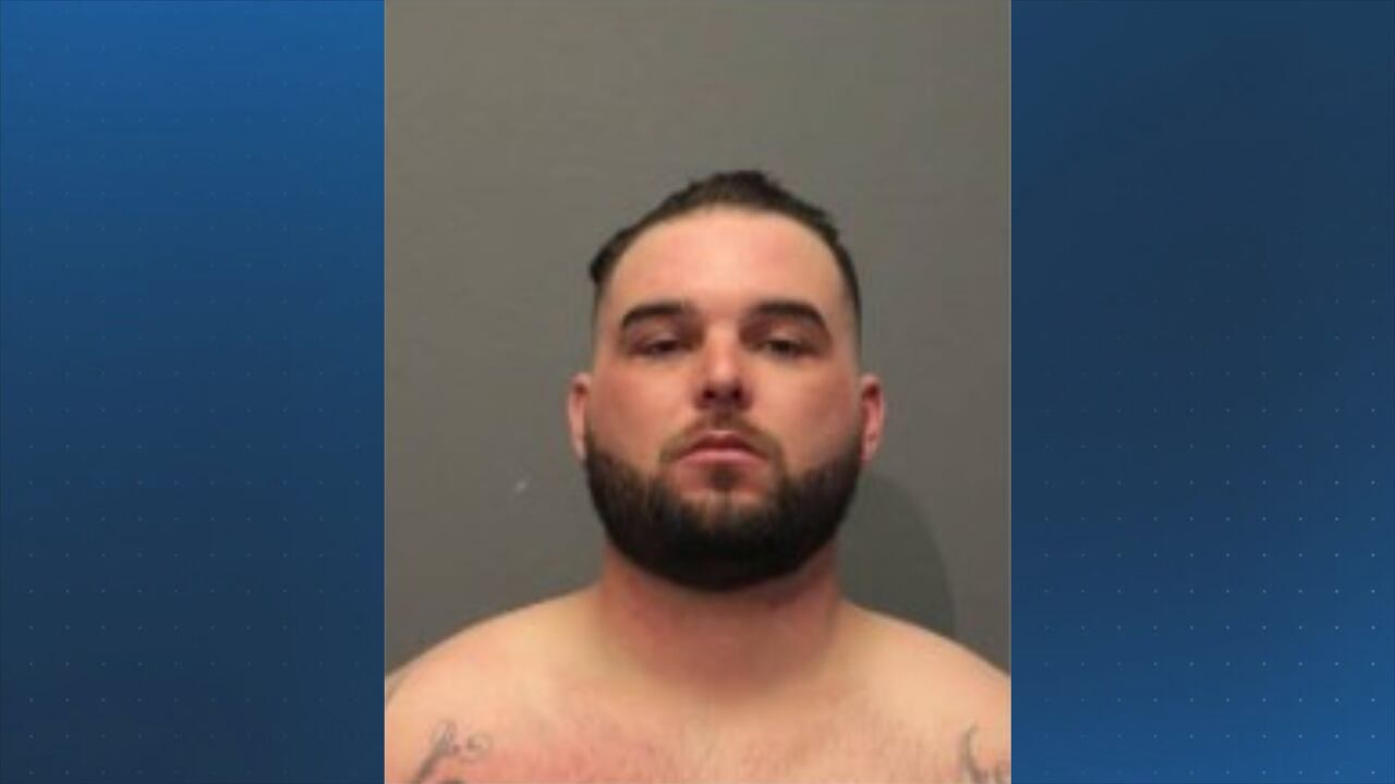 Milford man accused of hurling racial slurs at officer, defacing