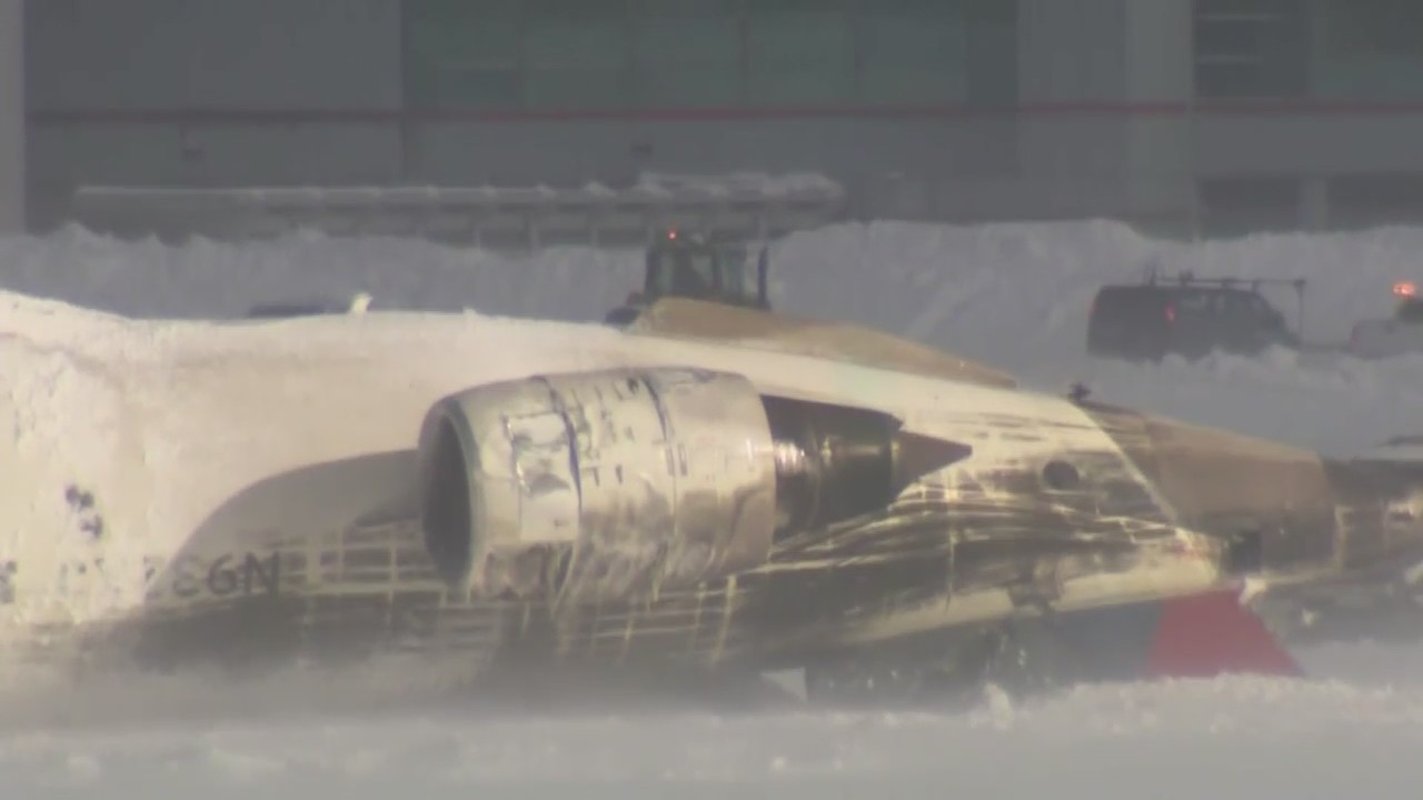 Delta Airlines plane flips on landing in Toronto and a badly hurt child