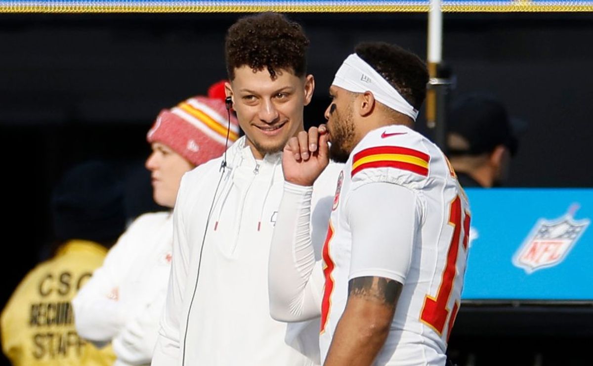 Patrick Mahomes #15 of the Kansas City Chiefs and Chris Oladokun #13 of the Kansas City Chiefs speak during a game against the Los Angeles Chargers at SoFi Stadium on January 07, 2024 in Inglewood, California.
