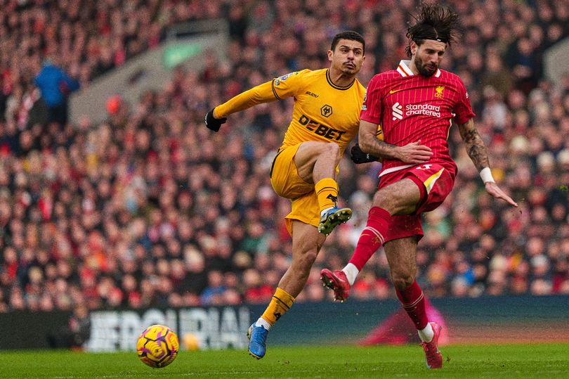 Andre Trindade challenges Dominik Szoboszlai at Anfield