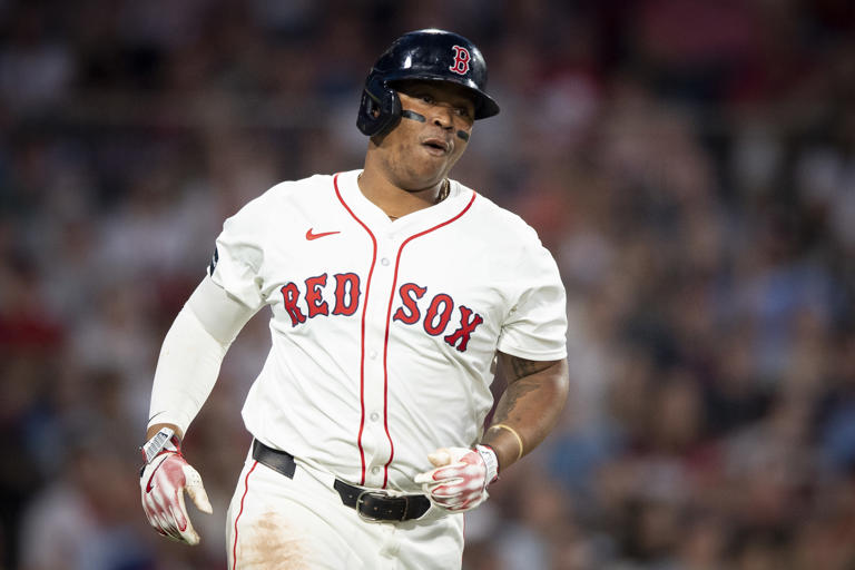 BOSTON, MA - JUNE 13: Rafael Devers #11 of the Boston Red Sox runs after hitting a single during the fourth inning of a game against the Philadelphia Phillies on June 13, 2024 at Fenway Park in Boston, Massachusetts. Maddie Malhotra/Boston Red Sox/Getty Images