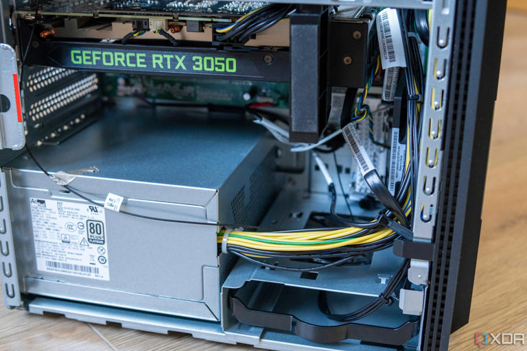 Close-up view of the bottom half of the interior of the Lenovo LOQ Tower 17, including the GPU, PSU, and one 3.5-inch hard drive bay.