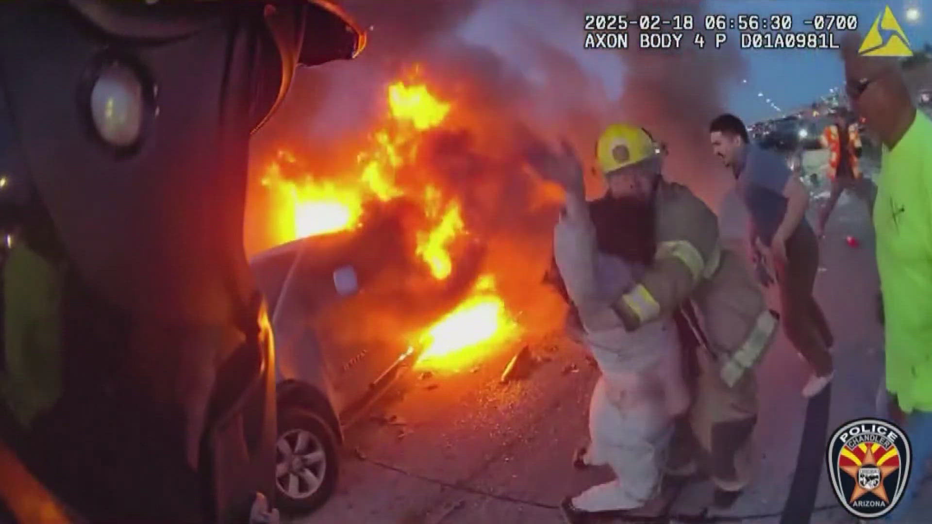 Off duty police officer, firefighter save woman from burning truck