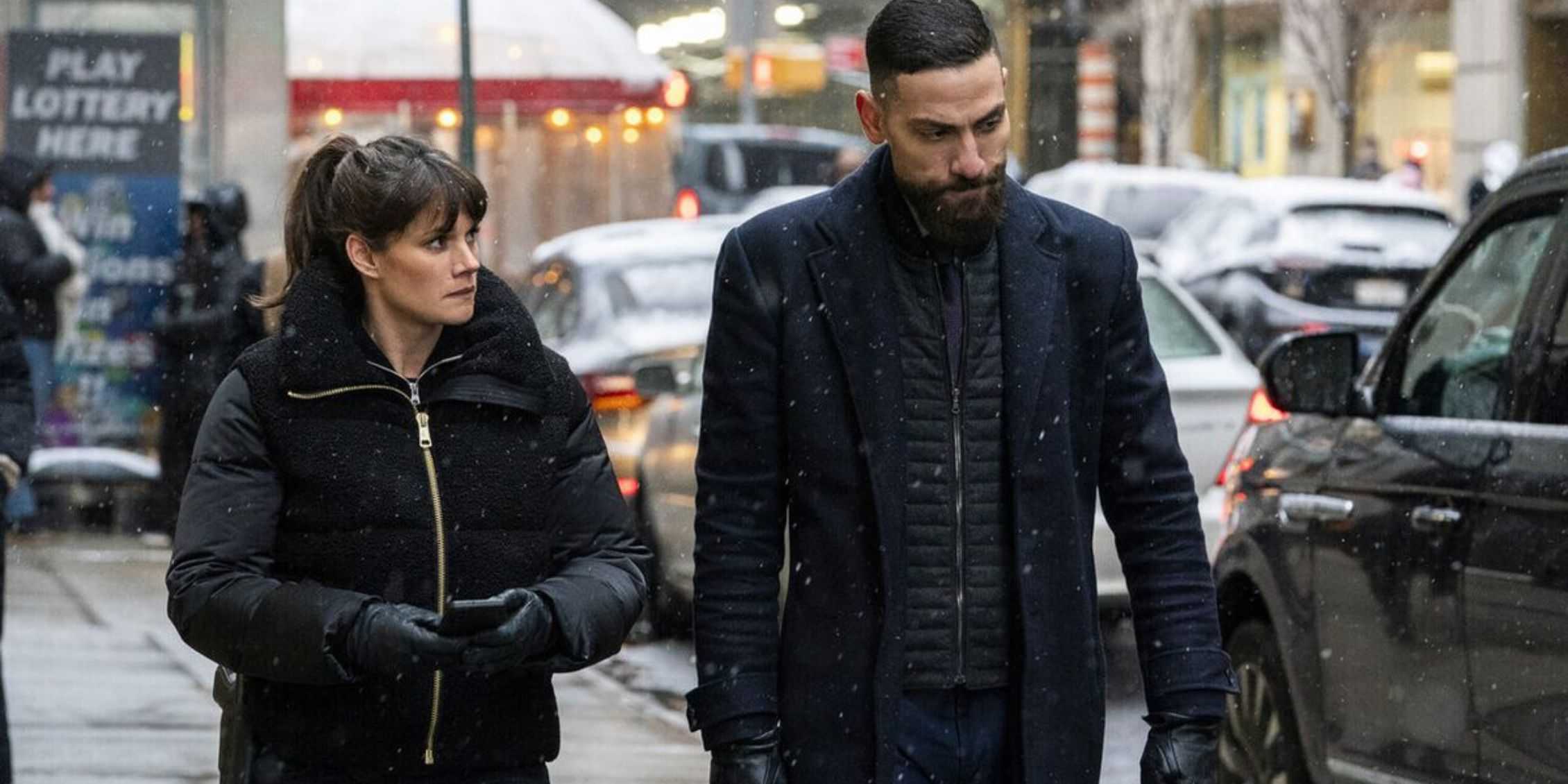 FBI OA And Maggie walking down a busy sreet on a cold day and wearing winter coats and gloves