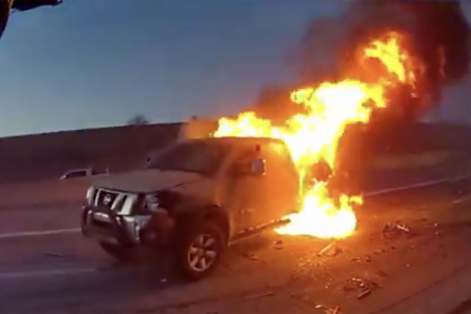 Police Officer and OffDuty Fireman Save Woman from Burning Car in
