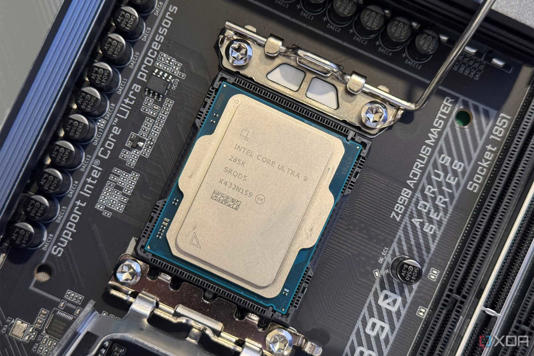 An image of an Intel core ultra 9 285k processor in socket with retaining clip open.