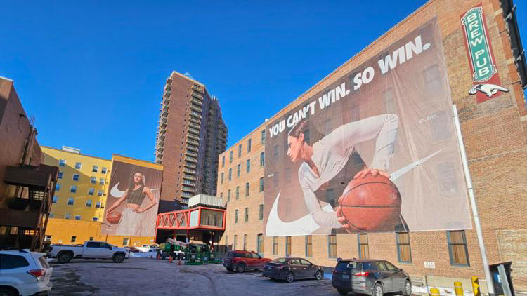 Caitlin Clark Nike banner unveiled on side of Court Avenue Restaurant & Brewing Company