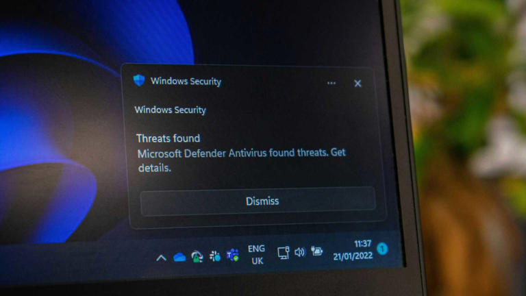 A Windows Security notification showing the Microsoft Defender Antivirus catching threats.