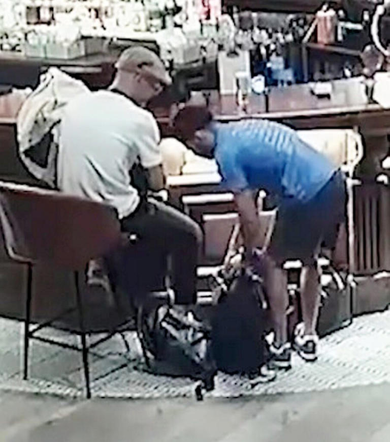 Thieves caught on CCTV rifling through bags in pub for seven minutes