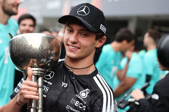 Kimi Antonelli holding a silver trophy