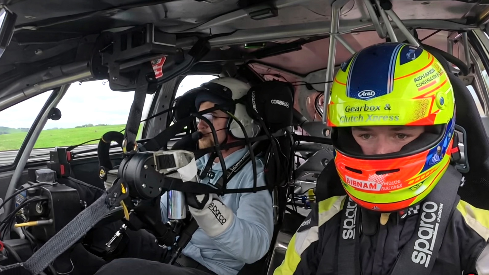 Experiencing a race car with guidance from a pro