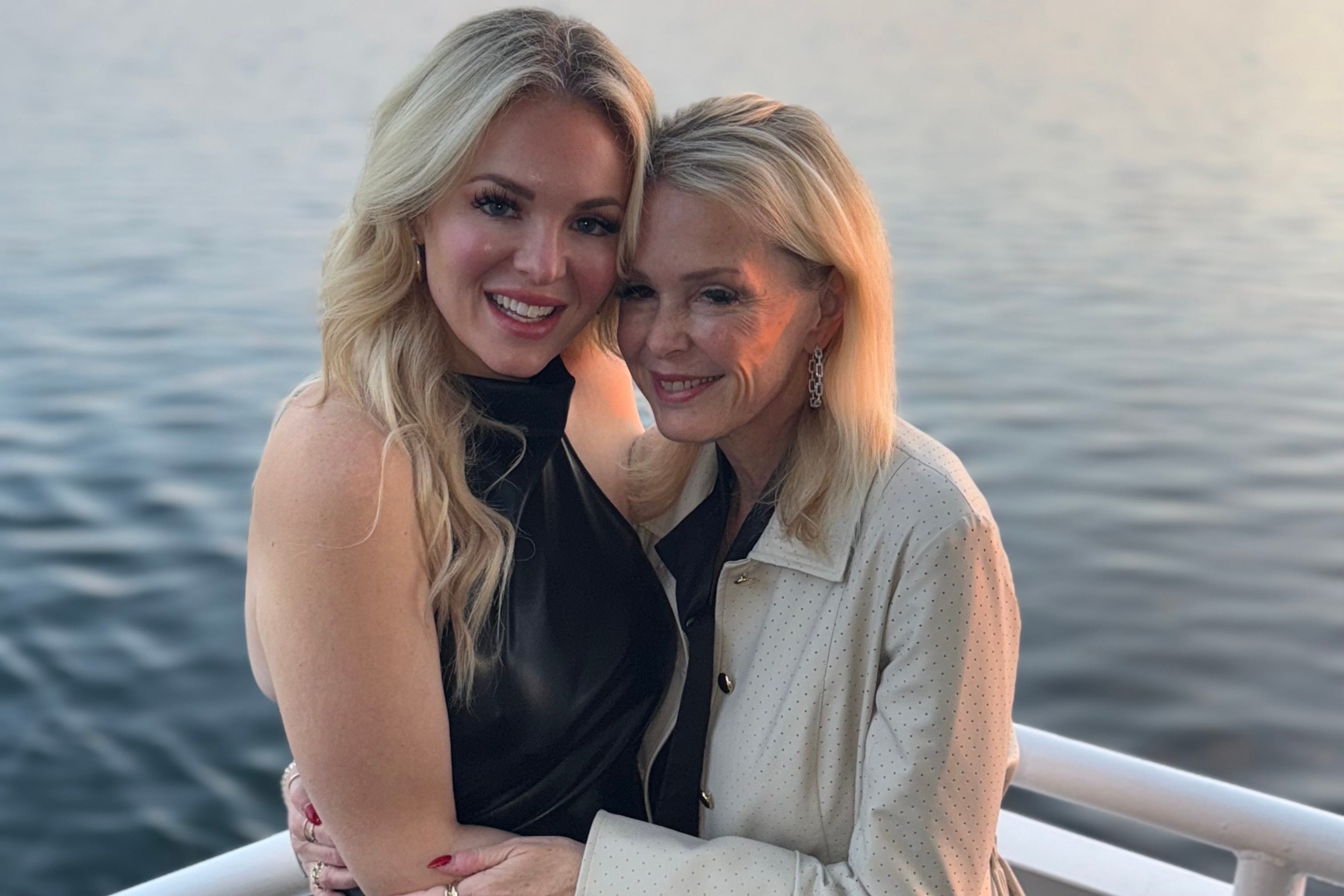 Mom and daughter posing for photo
