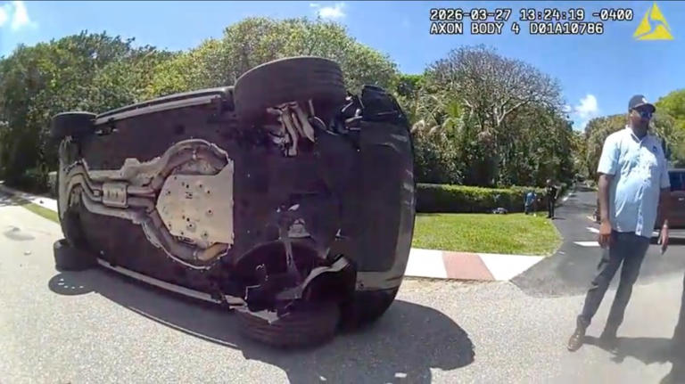 Newly released Tiger Woods bodycam footage shows golfer crouching on ...