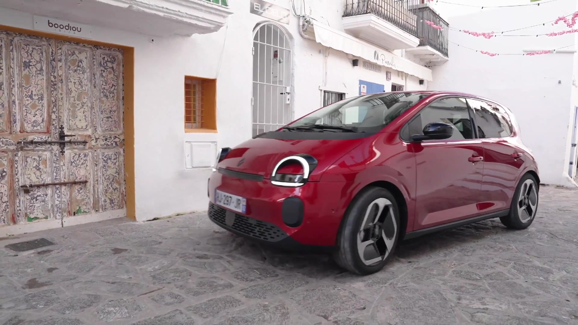 Renault Twingo E-Tech electric - Techno version in Absolute Red driving ...